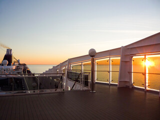 Beautiful sunset or sunrise or twilight at sea seen from modern MSC Cruises cruiseship or cruise...