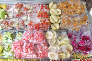 fruit slice cut in piece in plastic bag pack on tray for sell at Penang Malaysia