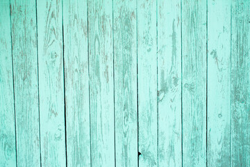 Fototapeta na wymiar Tourquoise aged wooden plank background. Textured wooden fence.