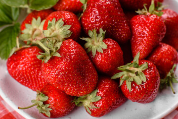 Beautiful juicy fresh strawberries on the concrete surface of the table