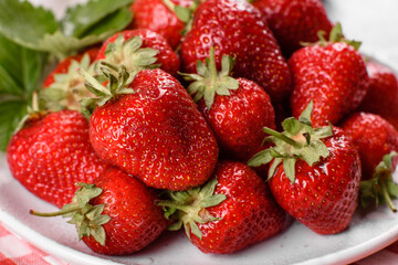 Beautiful juicy fresh strawberries on the concrete surface of the table