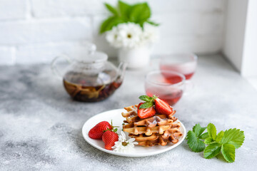 Delicious fresh baked belgian waffles with berries and fruit