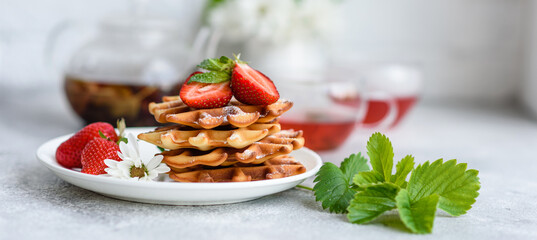 Delicious fresh baked belgian waffles with berries and fruit