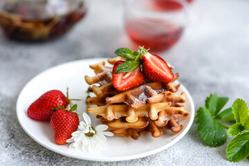 Delicious fresh baked belgian waffles with berries and fruit