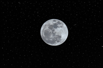 Fototapeta na wymiar Full moon in the dark sky with many stars.