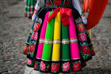 Women and young girls wearing regional folk costumes from Lowicz region in Poland during annual Corpus Christi procession