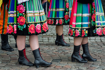 Women and young girls wearing regional folk costumes from Lowicz region in Poland during annual Corpus Christi procession