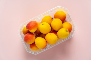 peaches in plastic packaging from a supermarket.