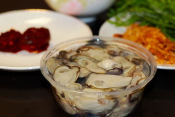 Fresh oysters closely on the table, served with oysters and side dishes Seafood for health Fresh...
