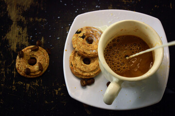 the process of making flat white coffee by pouring steam milk into a cup of espresso, served with...