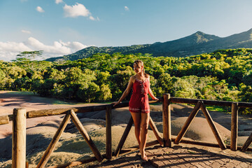 Attractive woman at Seven Coloured Earths in Chamarel National park, Mauritius