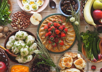 Photo above.A lot of wholesome vegetarian food on the table, ready to receive guests. Healthy homemade food.