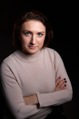 Portrait of middle age woman on black background