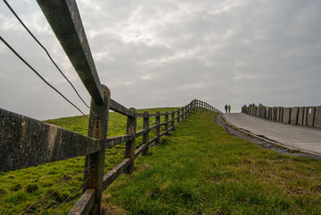 Fenced pathway in beautiful Ireland on a cloudy day