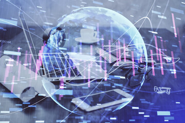 Stock market graph and table with computer background. Multi exposure. Concept of financial analysis.