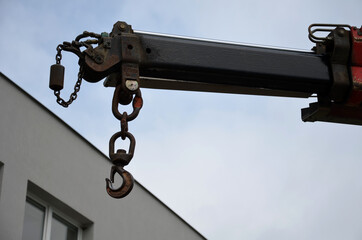 crane arm with metal hook in the air detail of craneing