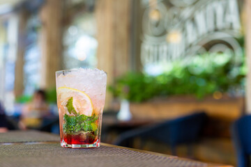 Refreshing mojito with crushed ice on a hot summer day