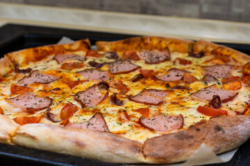 pizza with home delivery, eat at the table against the background of food