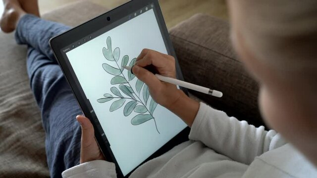 Woman drawing on the tablet