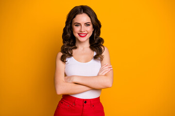 Obraz premium Photo of funny pretty cheerful wavy lady arms crossed self-confident person business woman wear white casual white tank-top red skirt isolated yellow color background