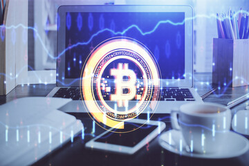 Multi exposure of blockchain and crypto economy theme hologram and table with computer background....