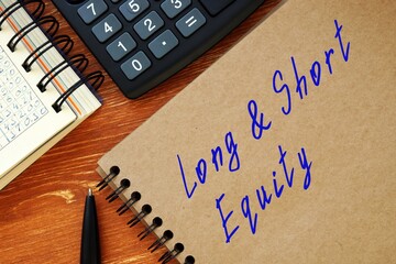 Financial concept meaning Long/Short Equity with inscription on the sheet.