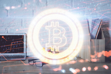 Multi exposure of blockchain and crypto economy theme hologram and table with computer background....