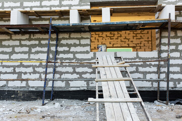 Construction of foam concrete blocks. Expansion of the room.