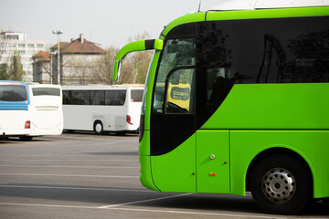 Green bus on the background of the station