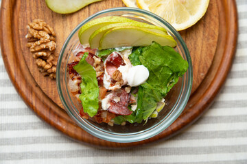 Pears and bacon salad for a healthy and fresh meal. Very tasty and very easy to cook. Add nuts and seeds and some sour cream with lemon juice for a great taste.