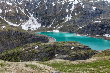 A dam on an alpine lake in Austria. View from the Grossglockner high mountain road.