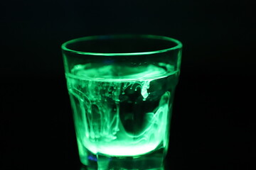 Glowing Green Liquid in a Glass