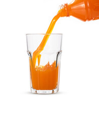 Pour orange juice in glass on white background