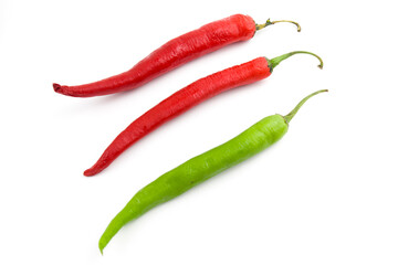 Fresh green chili pepper and dry red chili pepper. Isolated on white background.