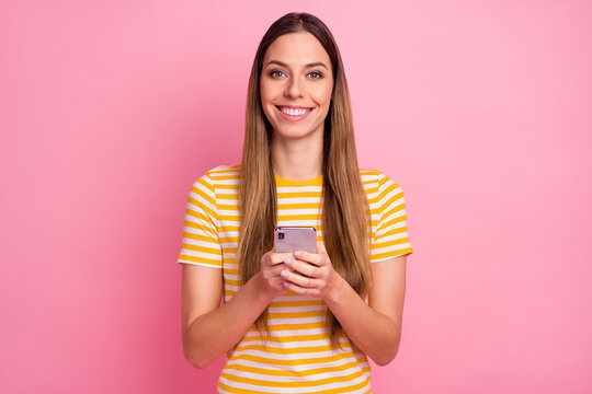 Close-up portrait of her she nice attractive lovely pretty cheerful cheery girl using digital 5g app posting comment feedback repost isolated over pink pastel color background