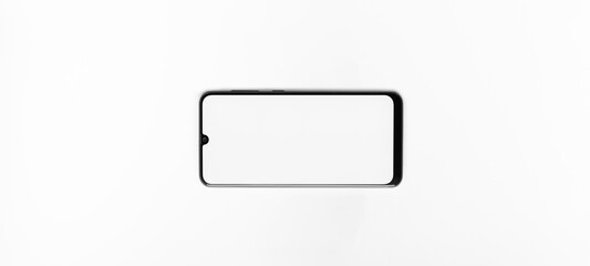 Mobile Phone with blank screen horizontally. Mobile Phone With White Screen on a white background. Top View. Take your screen to put on advertising