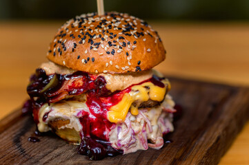 Close up tasty burger with minced meat served on tray