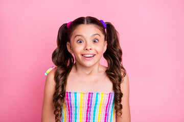 Closeup photo of beautiful little lady two lovely cute curly tails good mood open mouth good news wear casual colored rainbow dress summer singlet isolated pastel pink color background