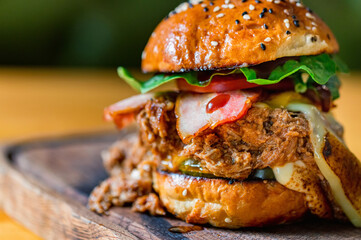 Close up tasty burger with minced meat served on tray
