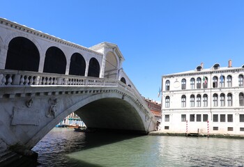 Rialto bridge over the Grand Canal in Venice with very few touri