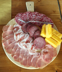 cold cuts from the wooden cutting board in the Italian farmhouse