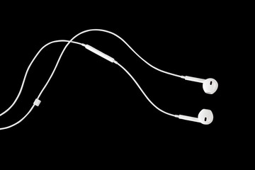 white earphone for listening isolated on black  background