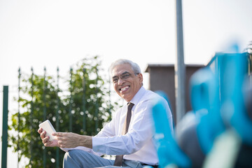 Senior businessman using digital tablet