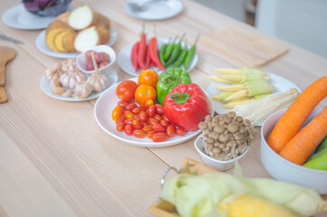 Fototapeta na wymiar Fresh vegetable and fruit on wooden table in kitchen
