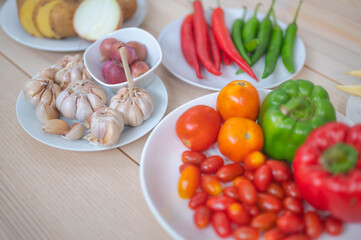 Fresh vegetable and fruit on wooden table in kitchen