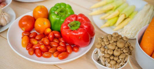 Fresh vegetable and fruit on wooden table in kitchen