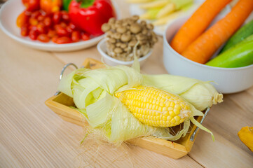 Fresh vegetable and fruit on wooden table in kitchen
