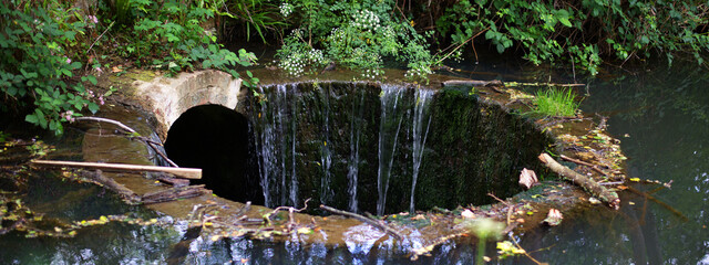 Burgess Hill sink hole water overflowing