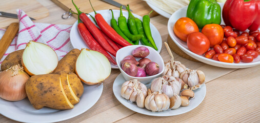 Fresh vegetable and fruit on wooden table in kitchen