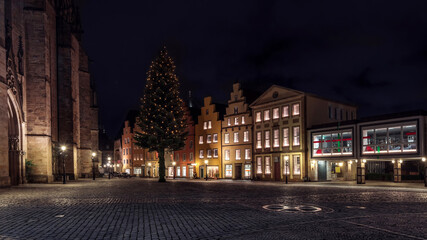 Historic old town Osnabrück with stepped gable houses and Christmas tree at night